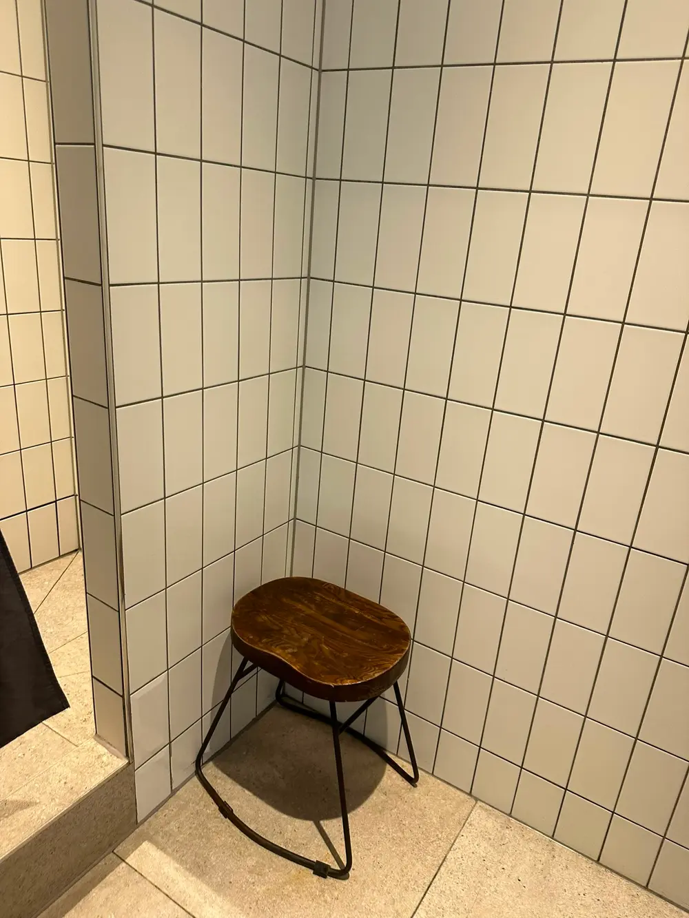 Gym changing room bench and stool in a London fitness facility after a professional deep clean