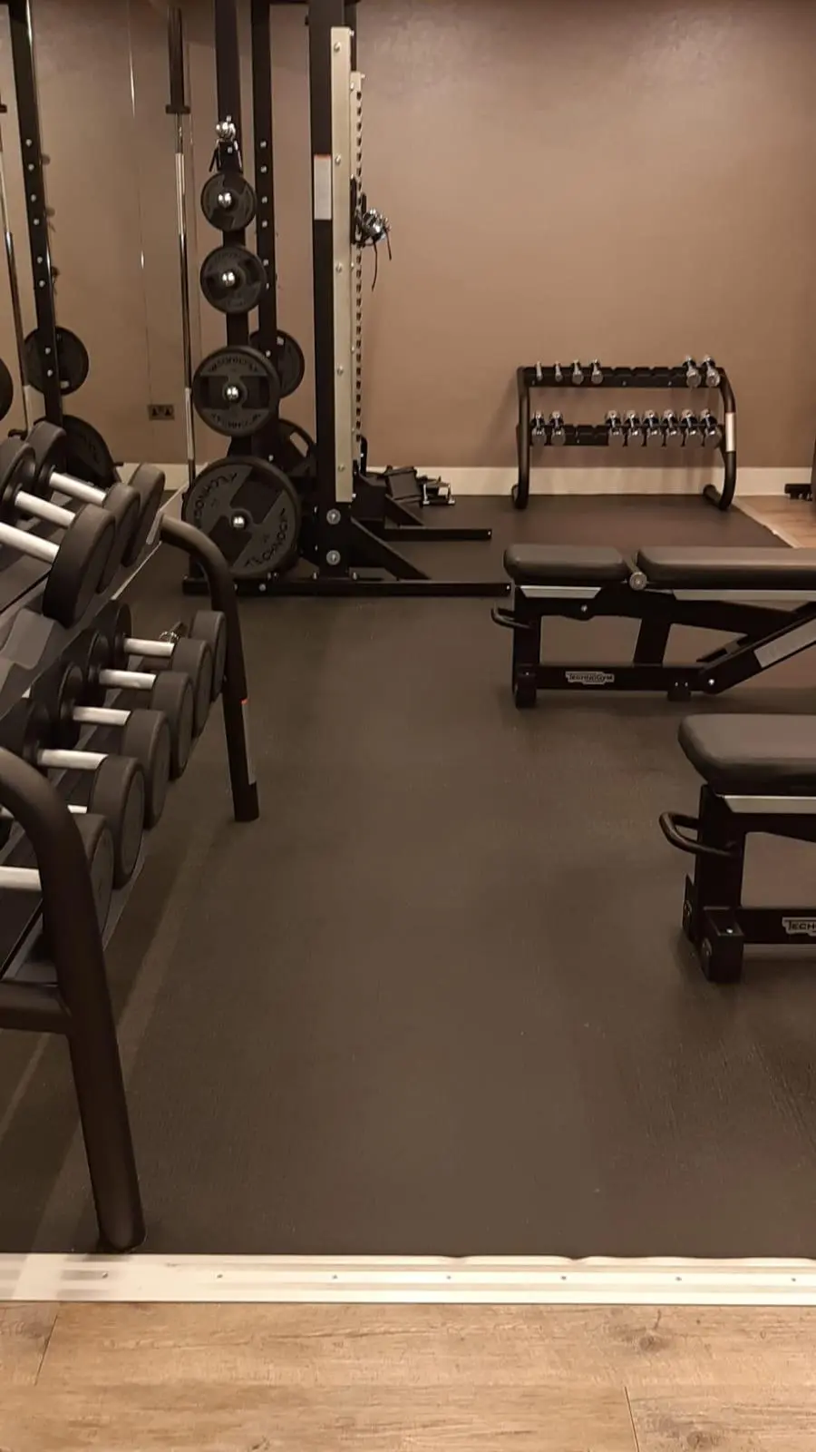 Clean gym weights and mat area in a London fitness facility after professional disinfection